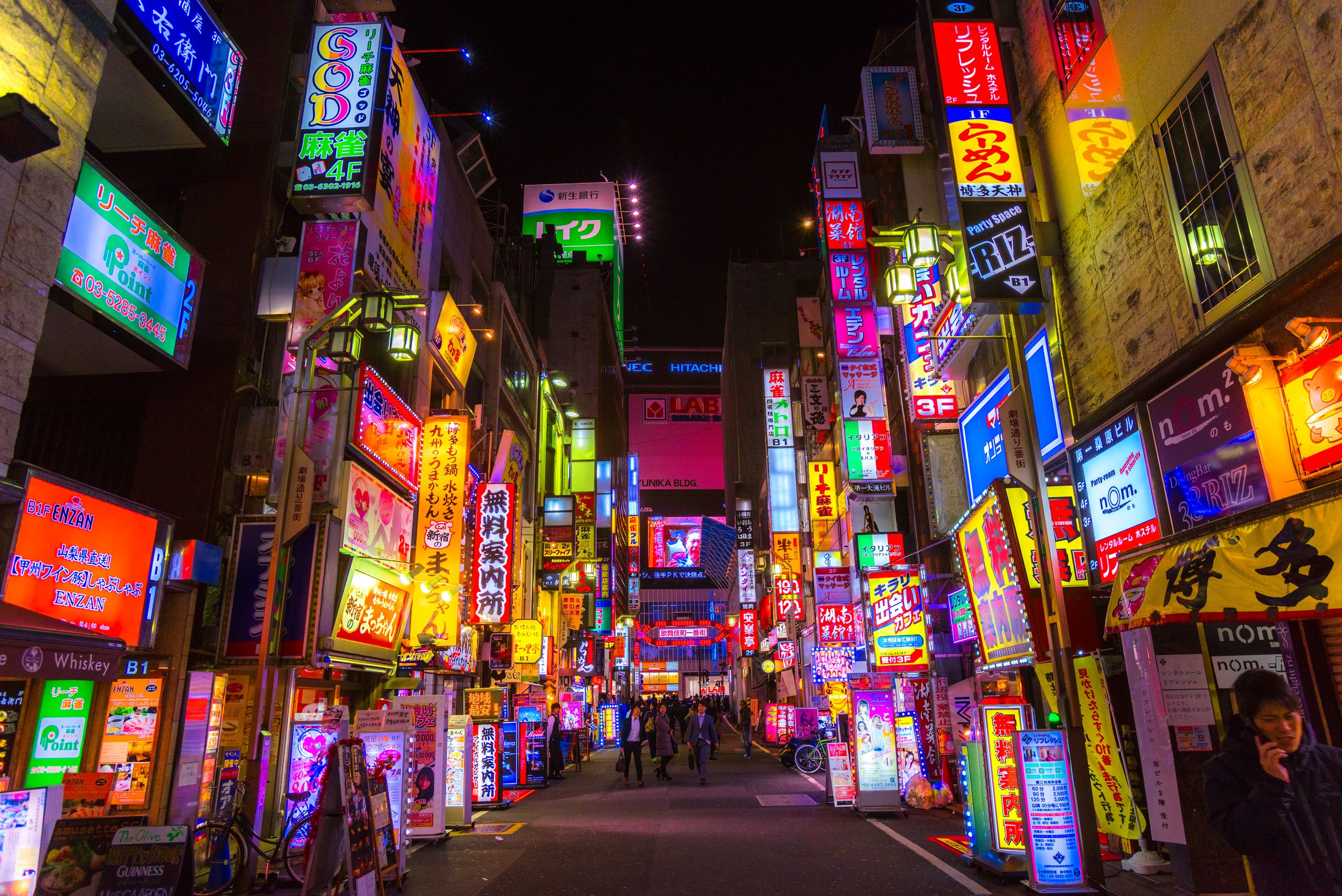 A banner image of a street with neon signs